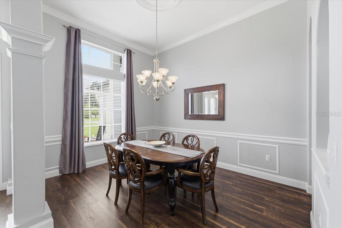 designated dining room space or convert with accent wall  trim work.