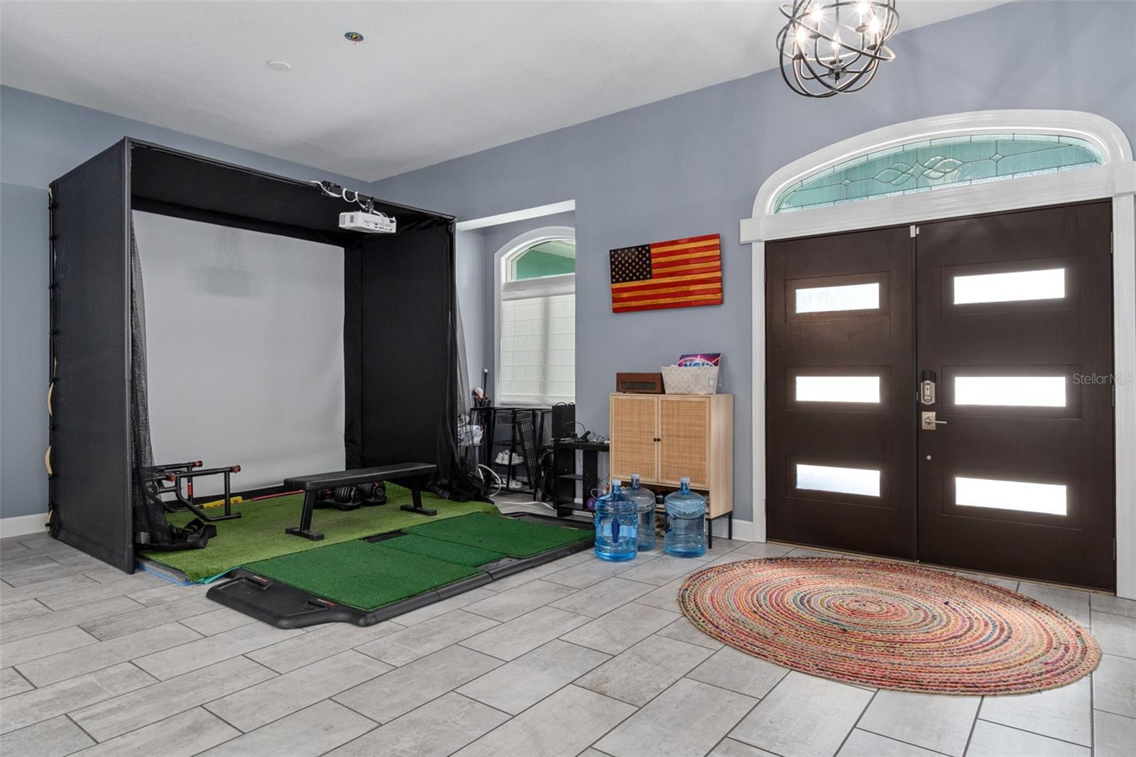 Dining Room - currently used for golf simulator (available for purchase with the home)