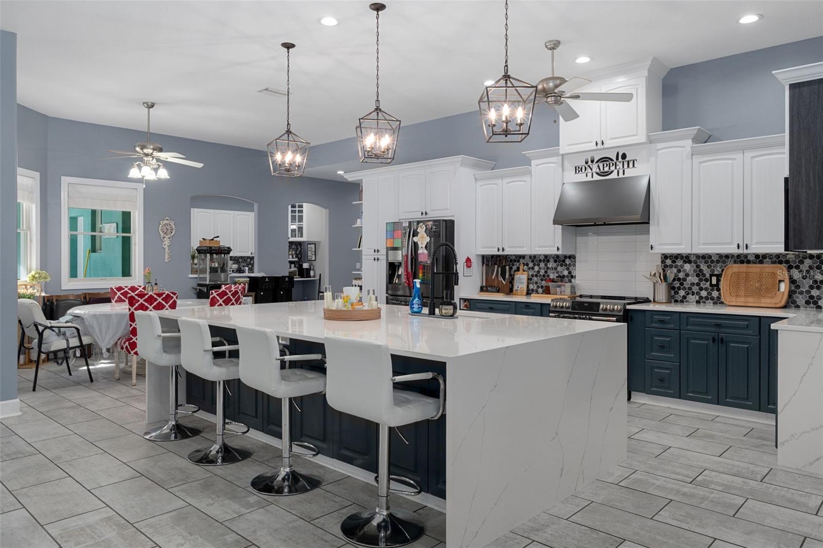 Gorgeous kitchen with quartz countertops and double wide island with waterfall ends.