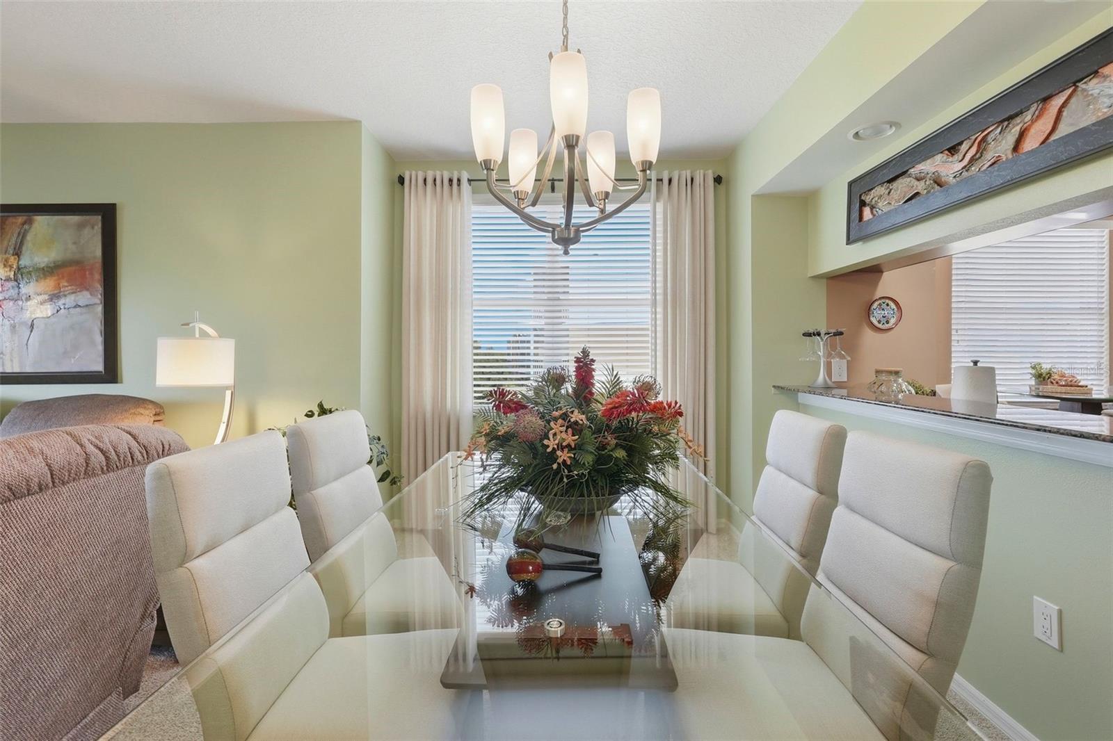 Elegant Dining Space with a window view of Lake