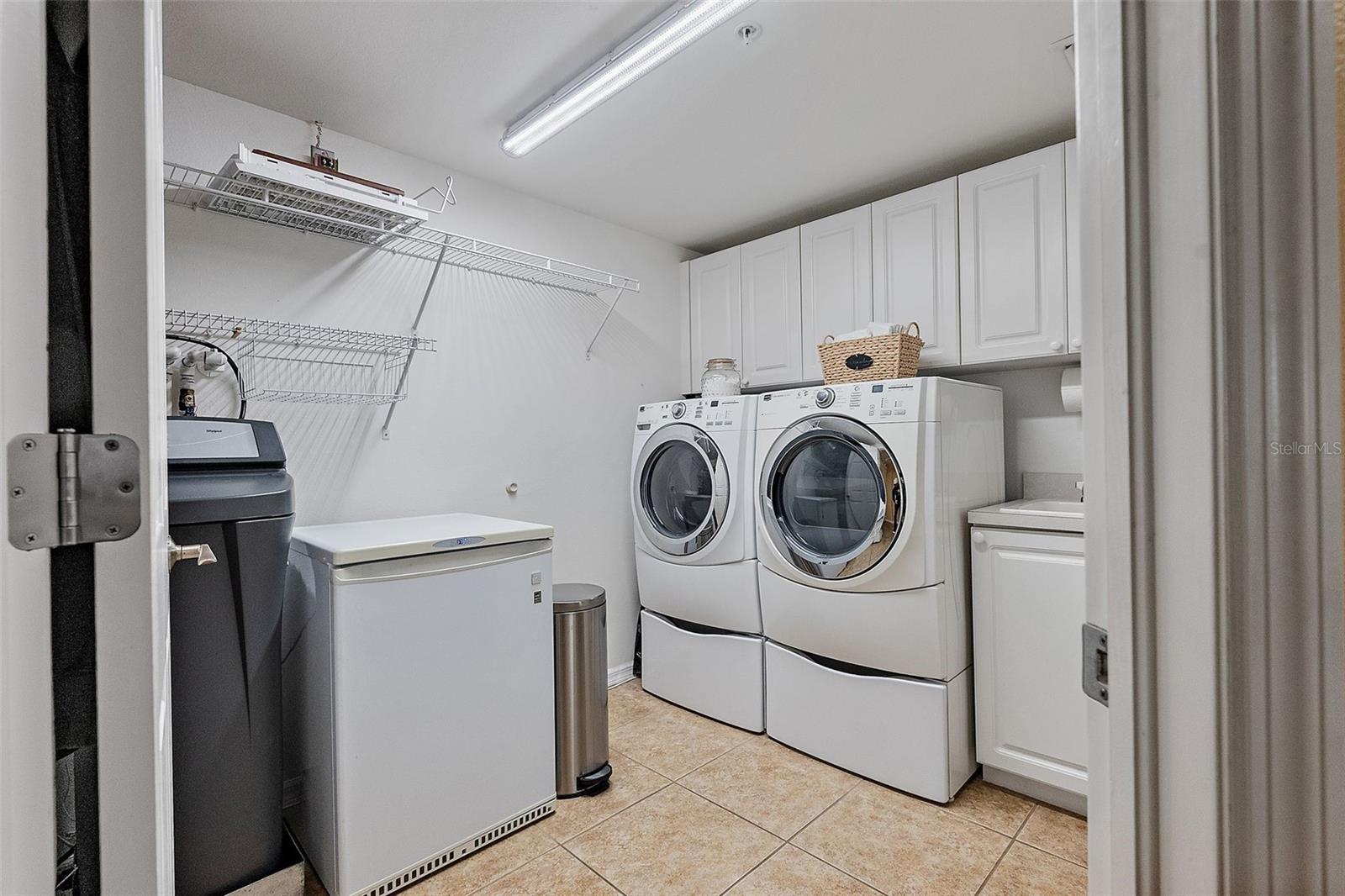 Laundry room with storage and wash sink