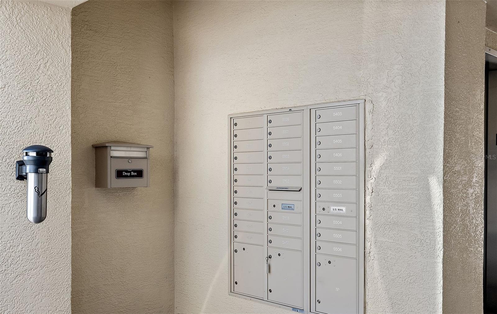 Locked mailboxes next to elevator