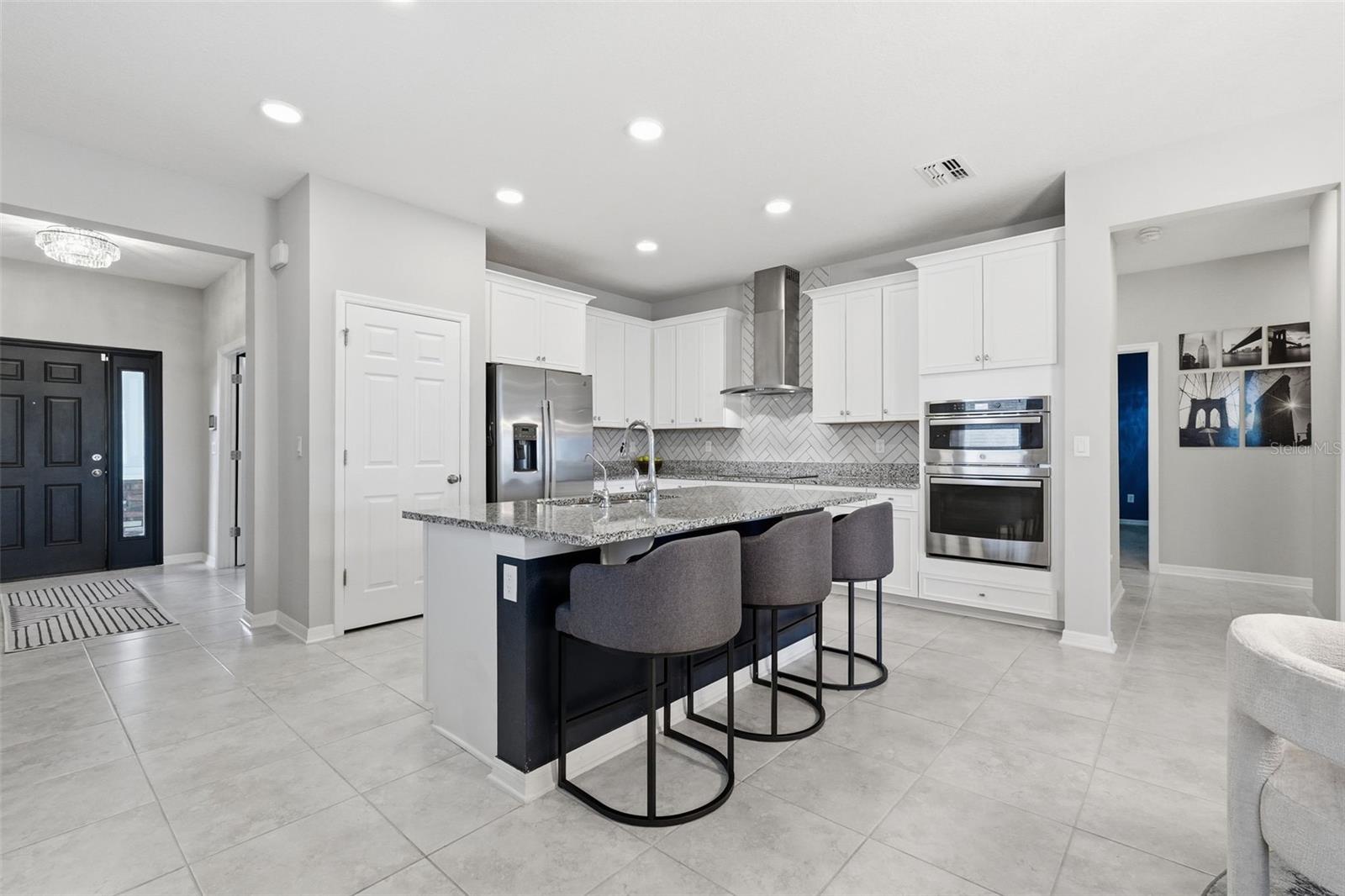 Kitchen, vent hood, built in oven and microwave