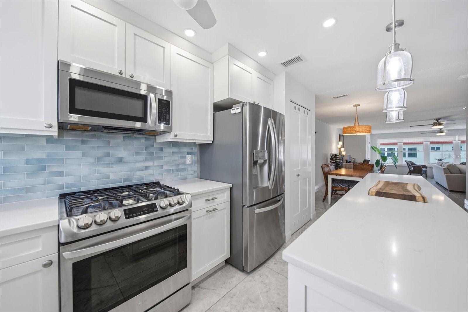 The open concept kitchen with gas range is a chef's dream.