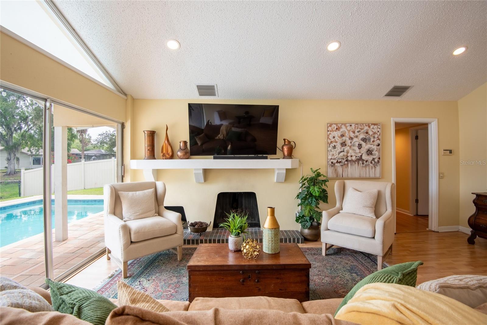 Cozy wood burning fireplace in the spacious living room.