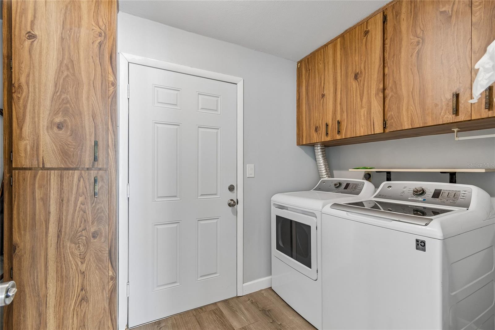 Laundry Room with Exterior Access & Storage