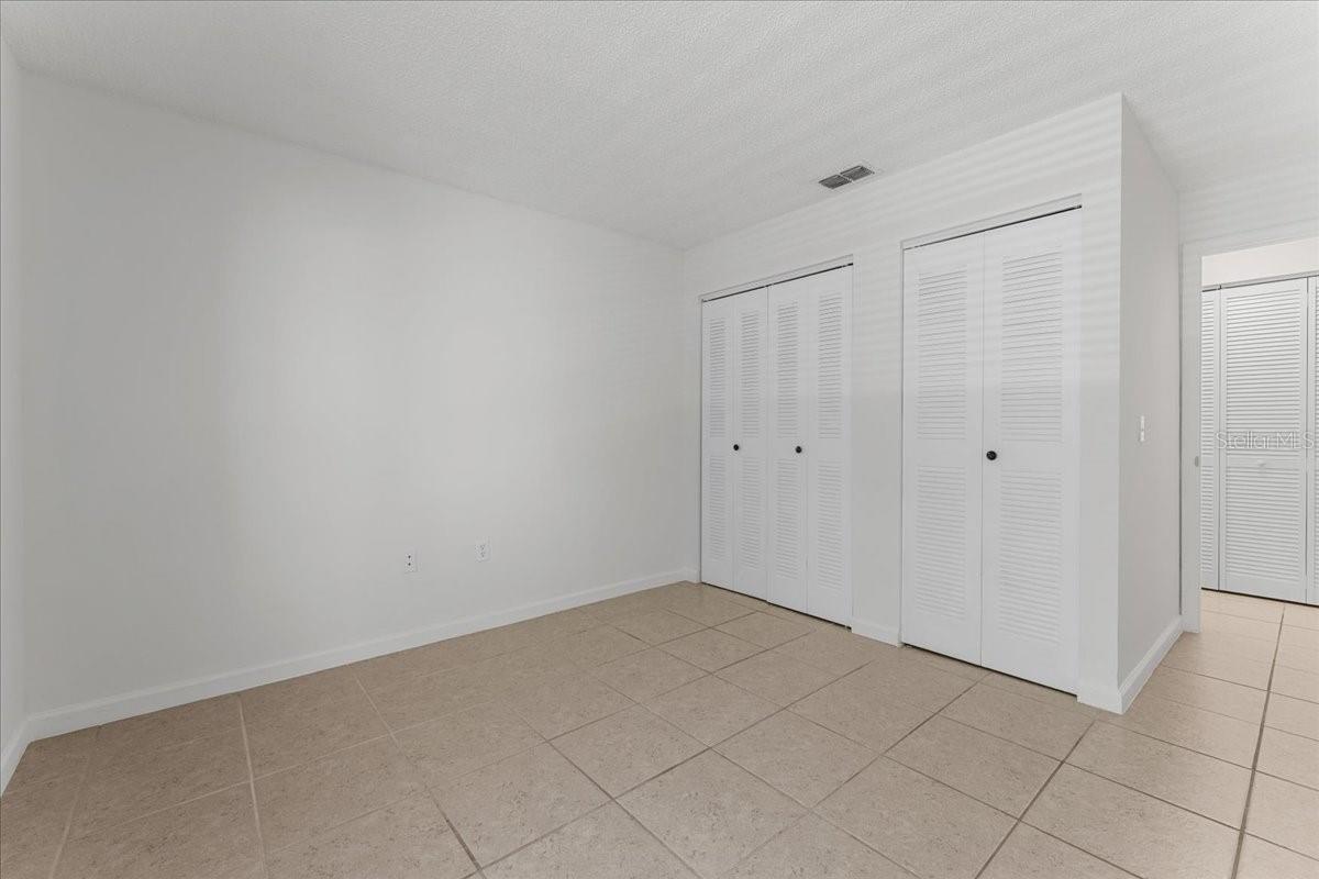 Bedroom 2 with dual closets