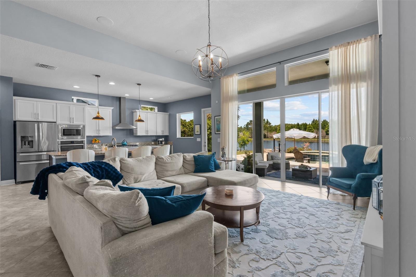 Natural light fills the living room through expansive sliding glass doors