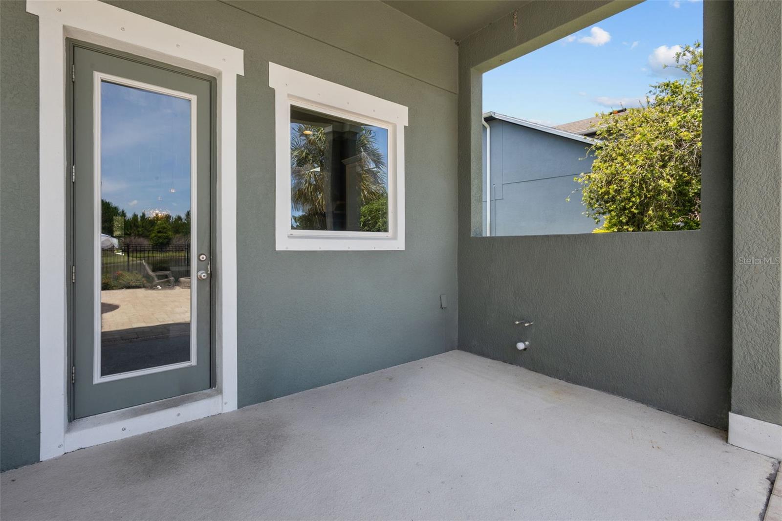 Outdoor living space is pre-plumbed for a future outdoor kitchen