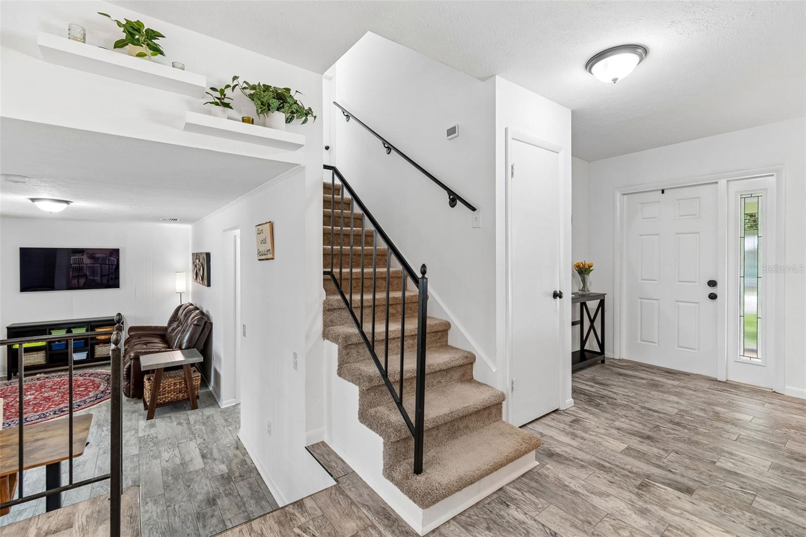 Stairs down to family room and guest bedroom and bath; and stairs up to all bedrooms and bathrooms.