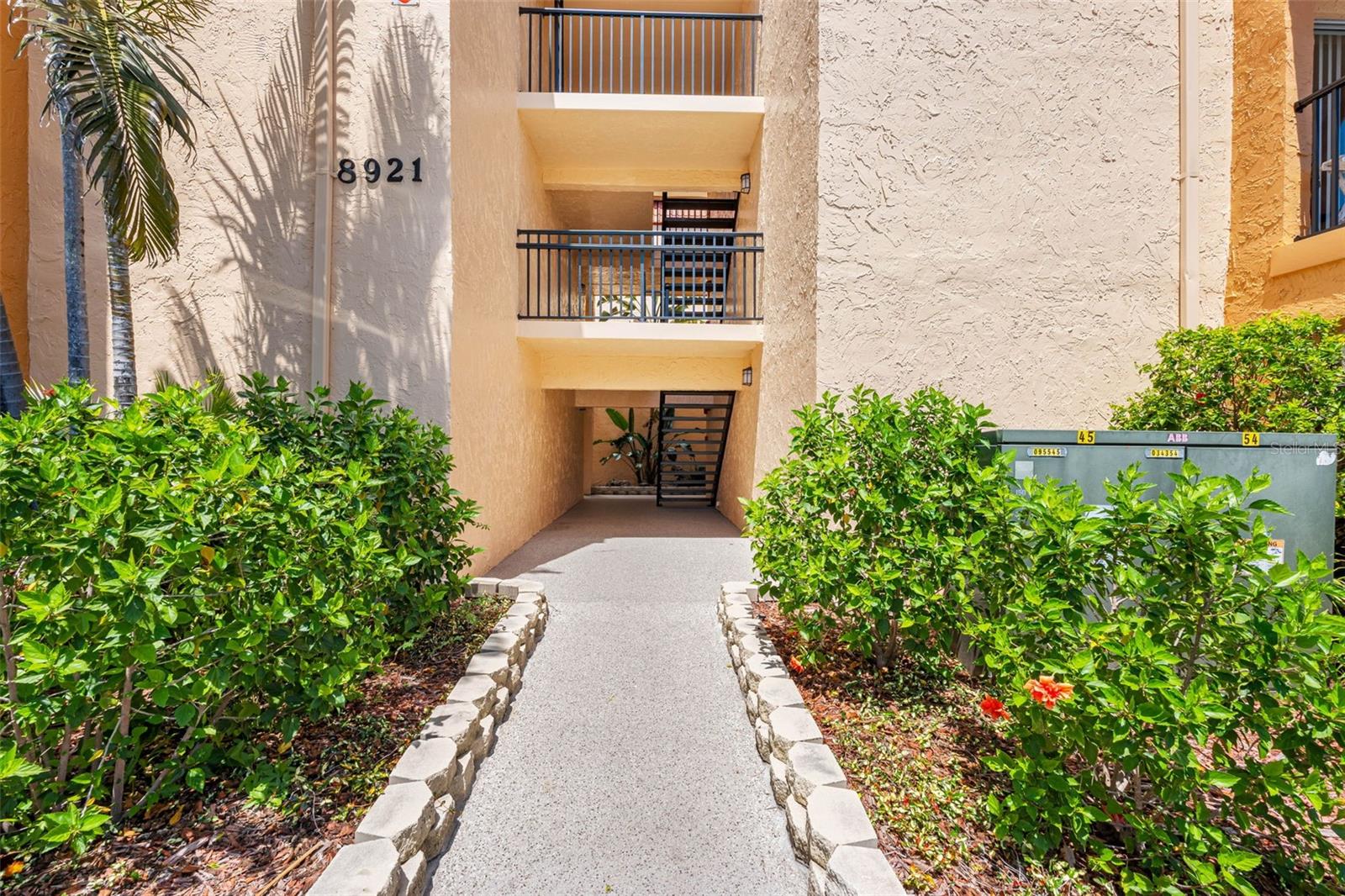 Enter the 8921 building and turn a sharp right and then a sharp left toward the water