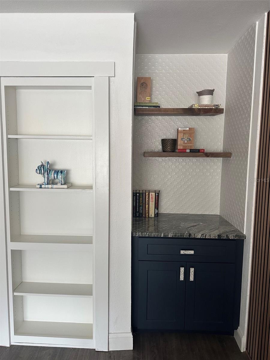 Bookshelf with hidden storage closet