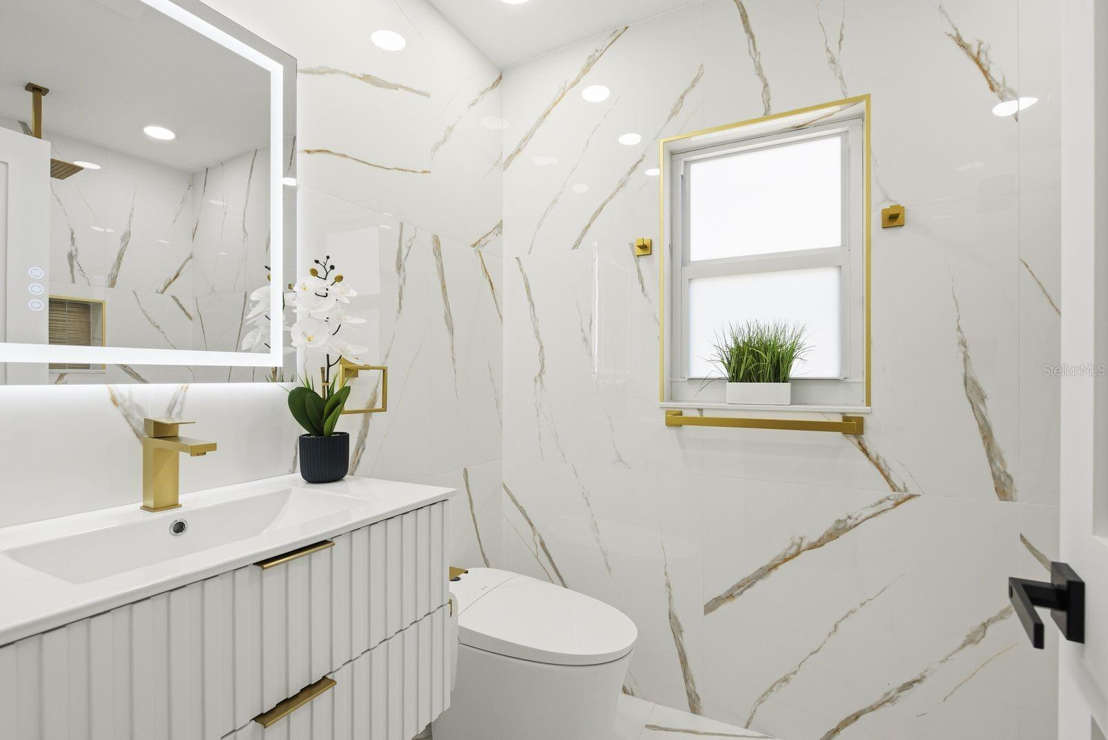 Master bathroom -beautifully remodeled with tile extending all the way to the ceiling for a clean, upscale look.