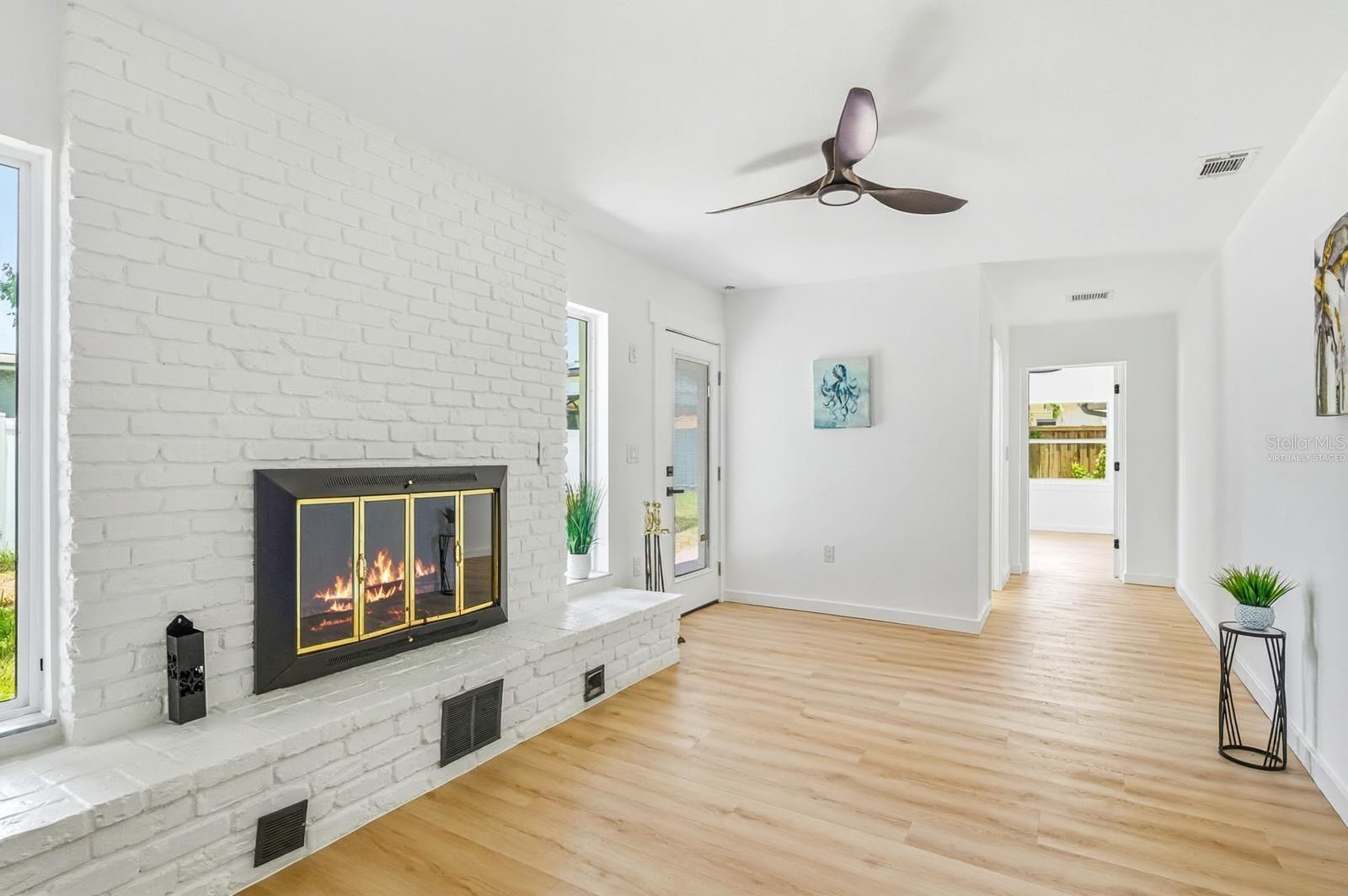 *Fire is virtually staged* - One unique feature of this home is this bedroom, which can easily be used as a mother-in-law suite thanks to its private entrance to the backyard, en suite bathroom, and two walk-in closets.
