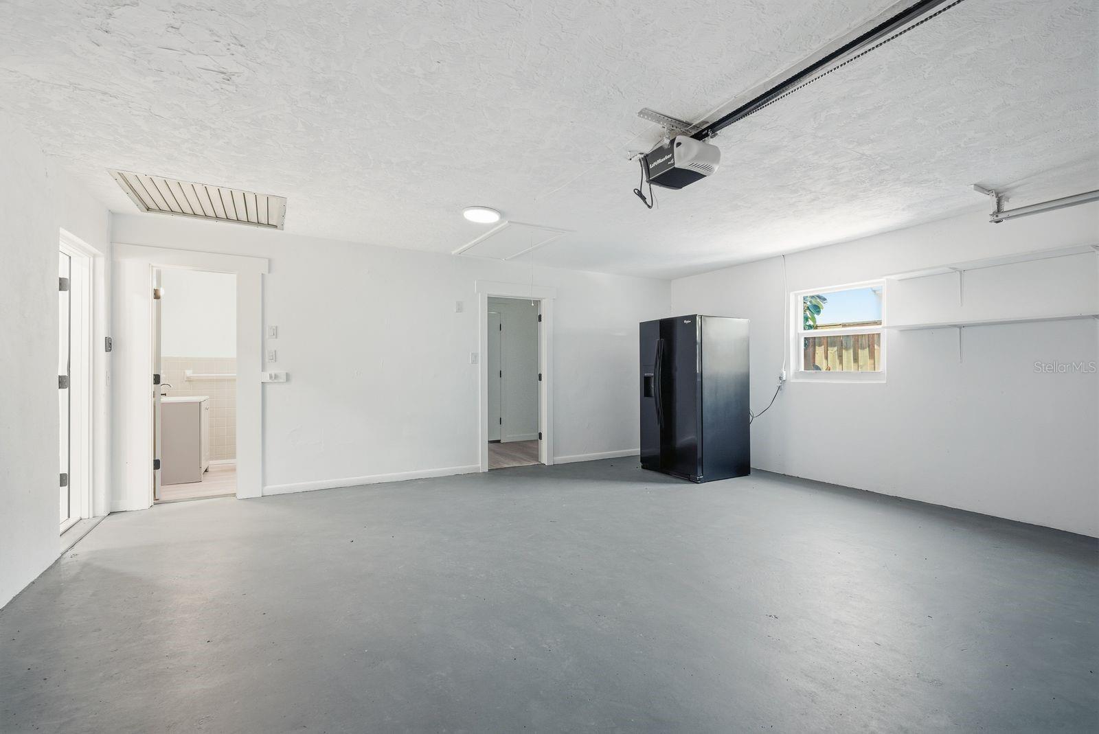 2 car garage. Extra fridge stays with the house.