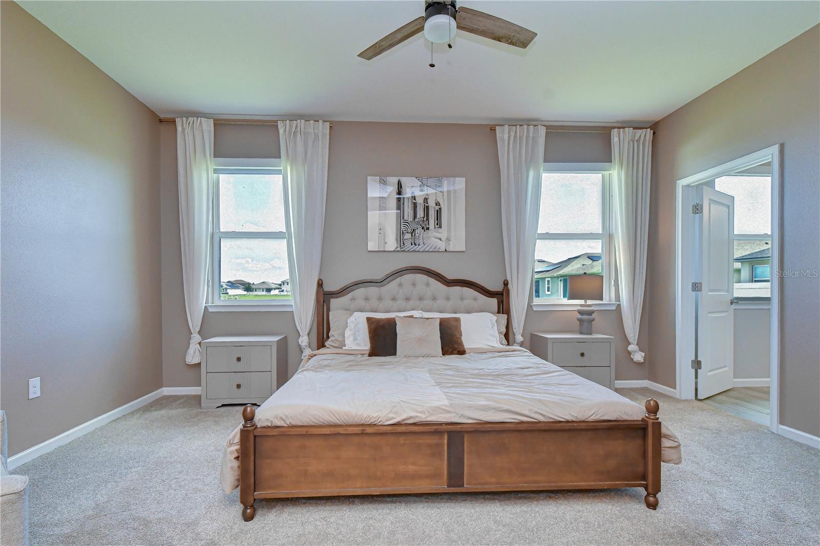 Spacious owner's retreat designed for relaxation.