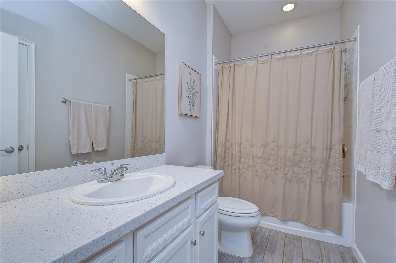 Well-maintained secondary bathroom serving guest rooms.