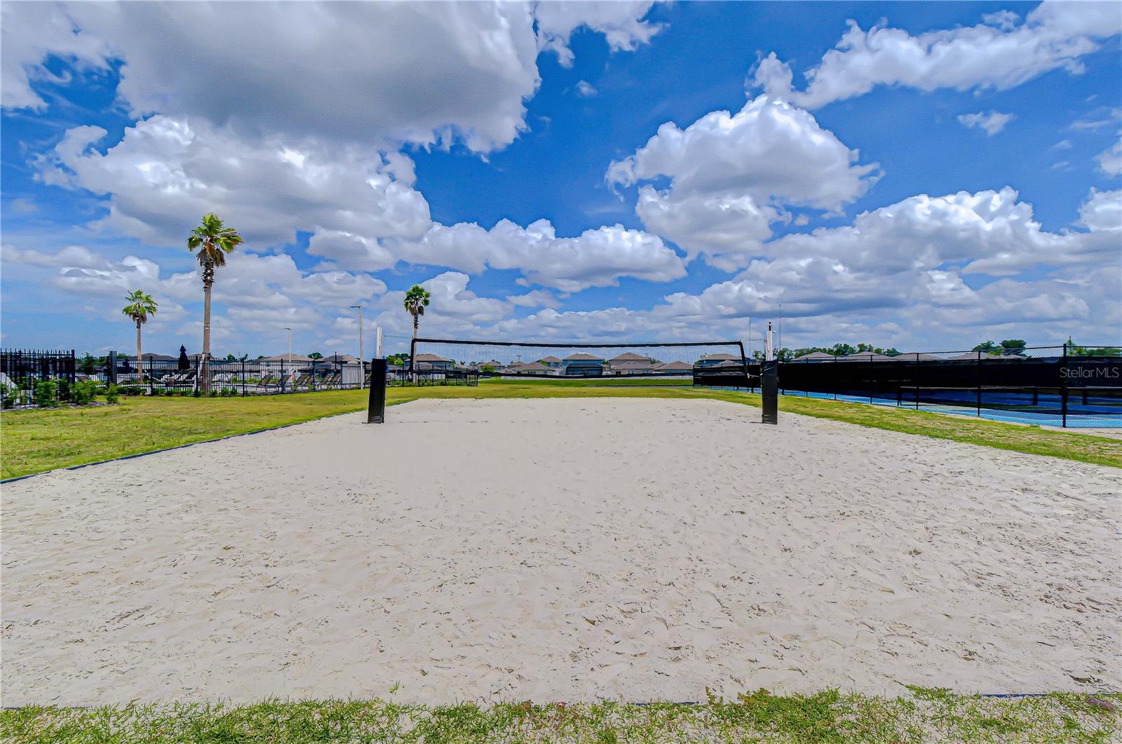 Resort-style community sand volleyball court.