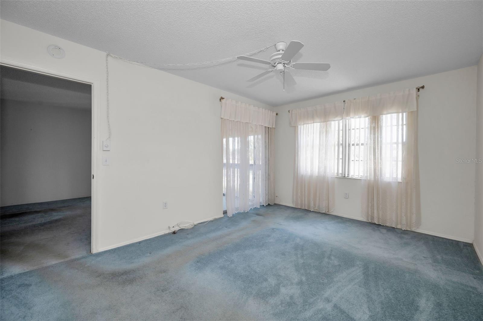 Primary bedroom also has multiple windows for lots of natural light.