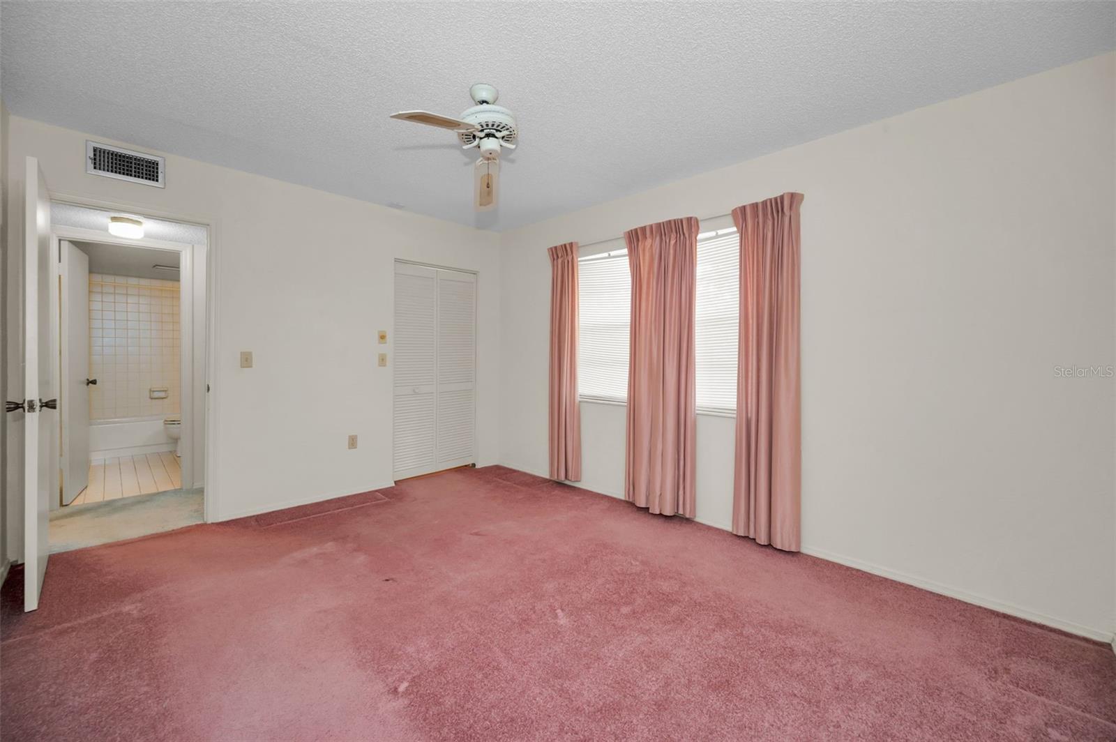 Spacious guest bedroom with bathroom right across the hall.