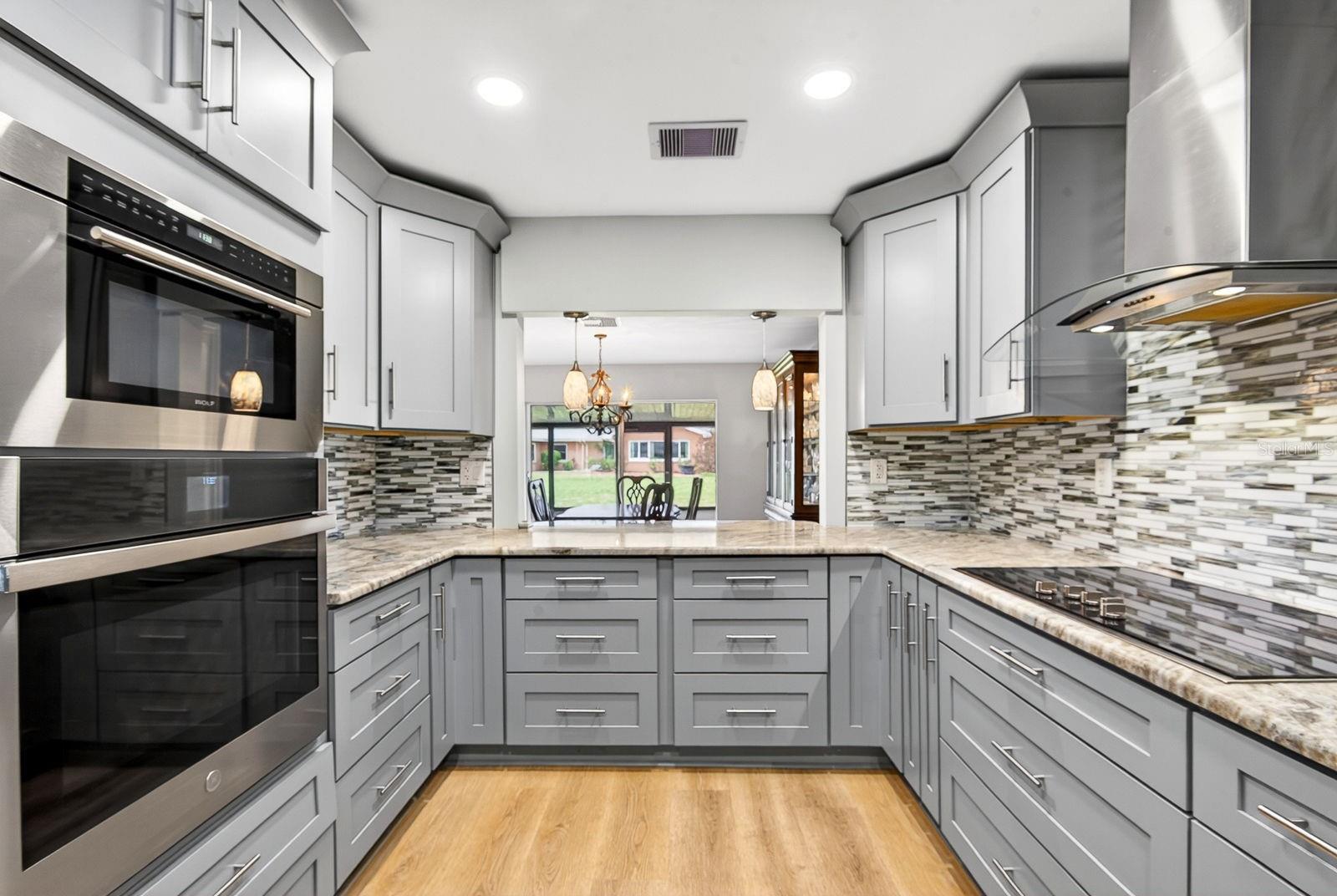 Kitchen facing into Dining and Rear of home