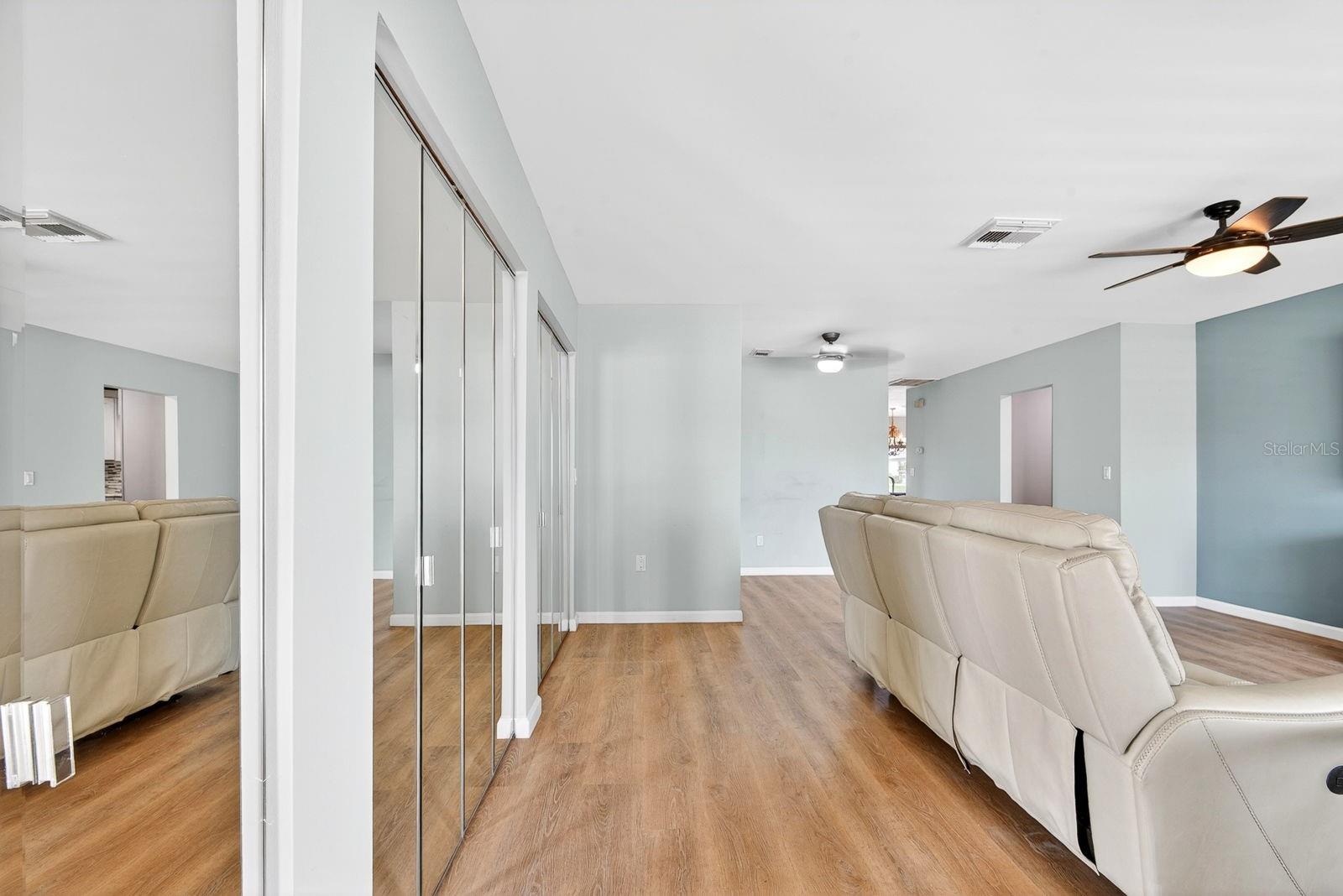 Entry showing living area to the right and storage closet on the left