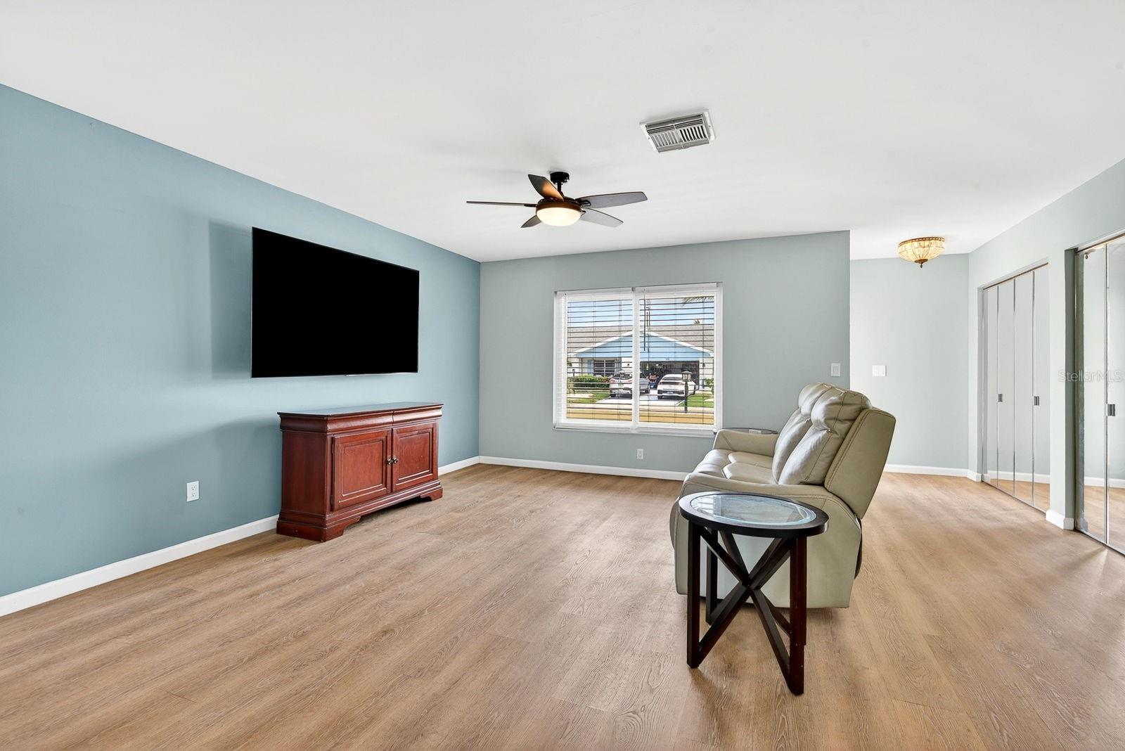 Large living area with beautiful new flooring
