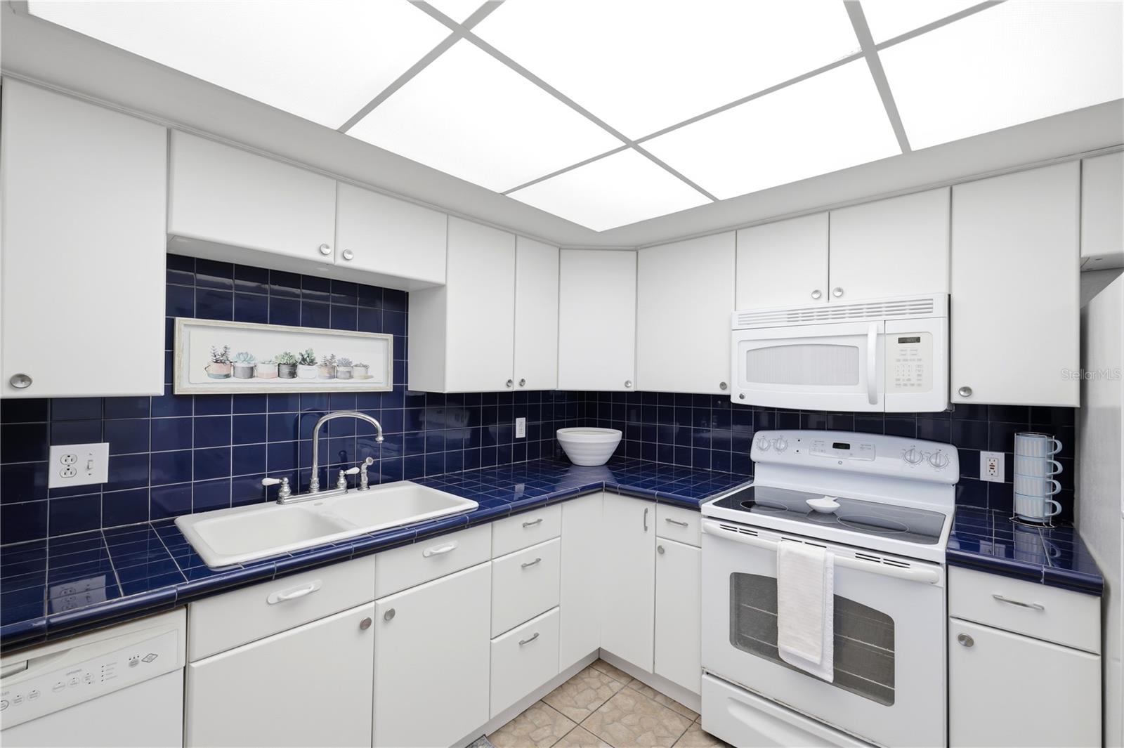 colorful coastal blue backsplash and counters