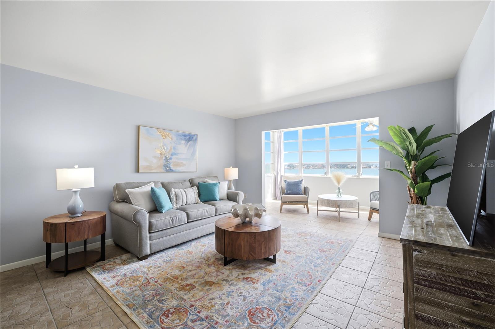 large living room area with views of the water