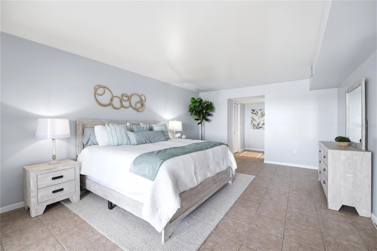 tastefully decorated oversized master bedroom