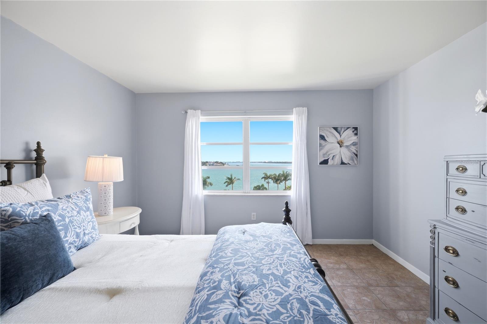 second bedroom shown with a queen and plenty of room for a king