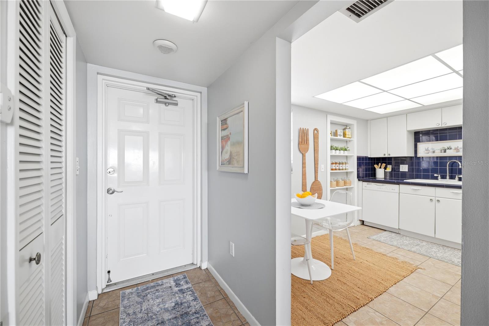 front entry leading into the kitchen