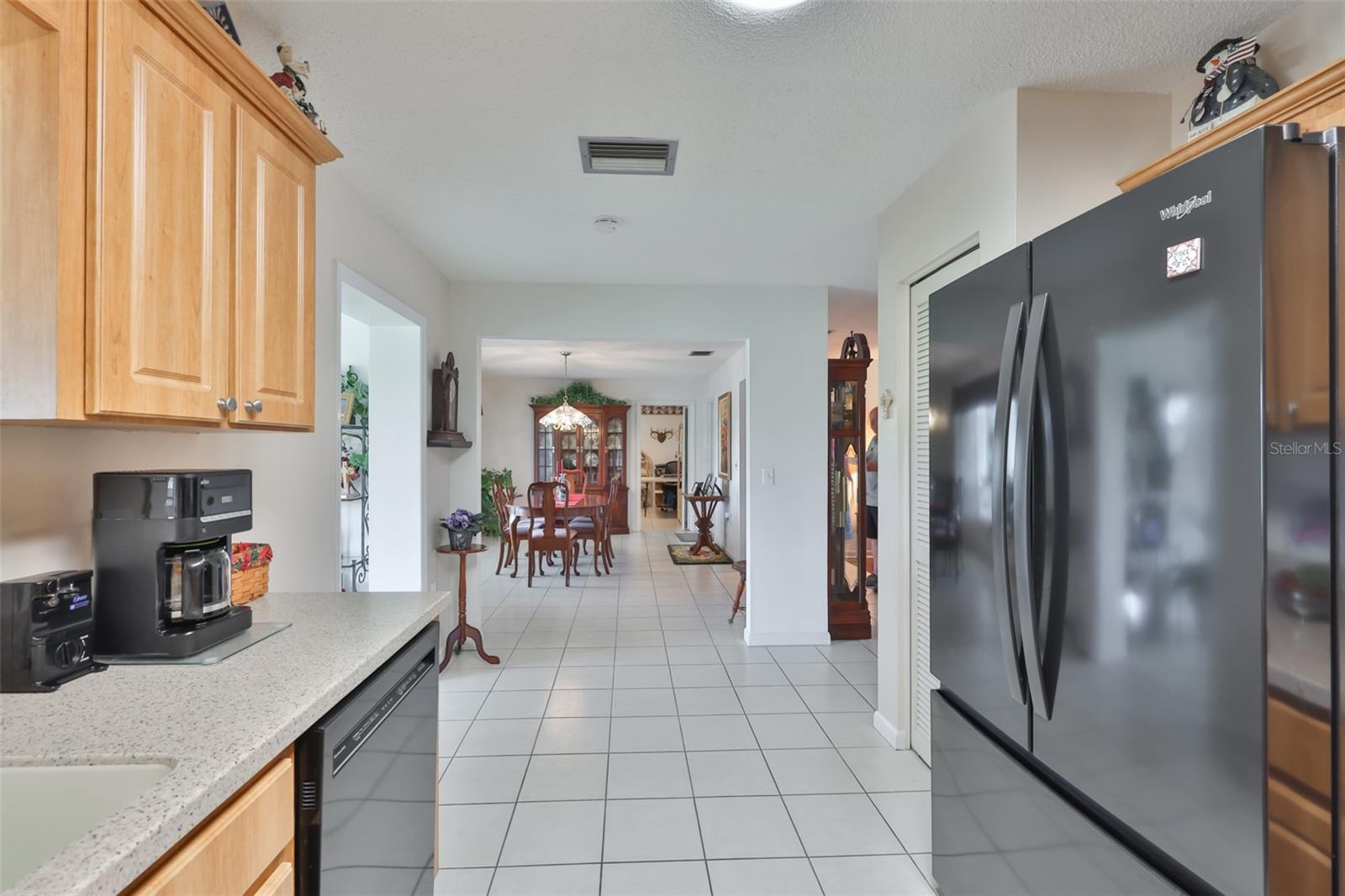 Kitchen, Wood Cabinets, Corian Countertop, Pantry, & Solar Tube