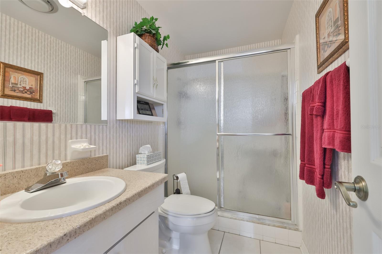 Primary Bathroom, Walk-In Shower, Matching Corian Countertop