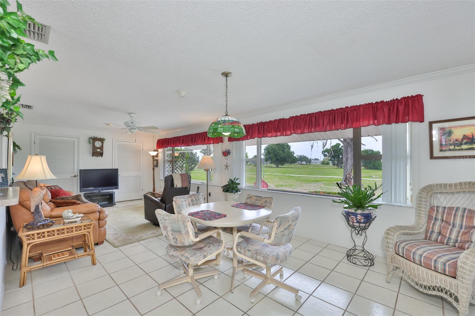Large Climate Controlled Enclosed Lanai, Two Picture Windows Plenty of Natural Light & Built-In Storage