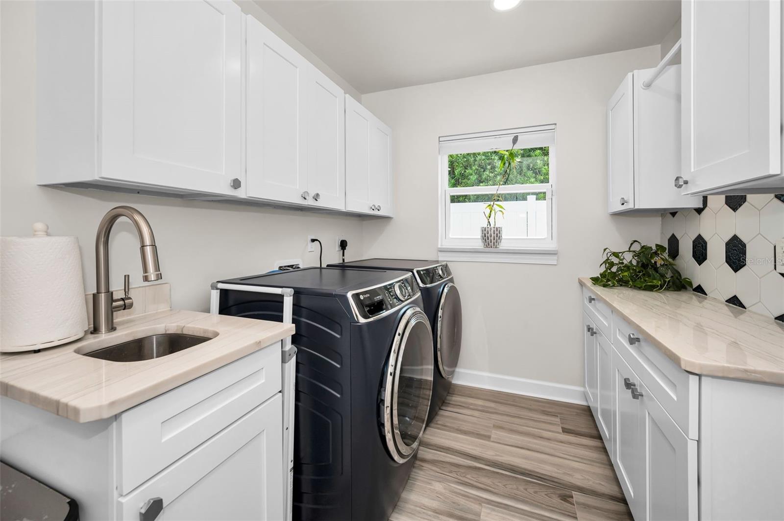Utility Sink in Laundry Room w/ Folding area & storage Closet