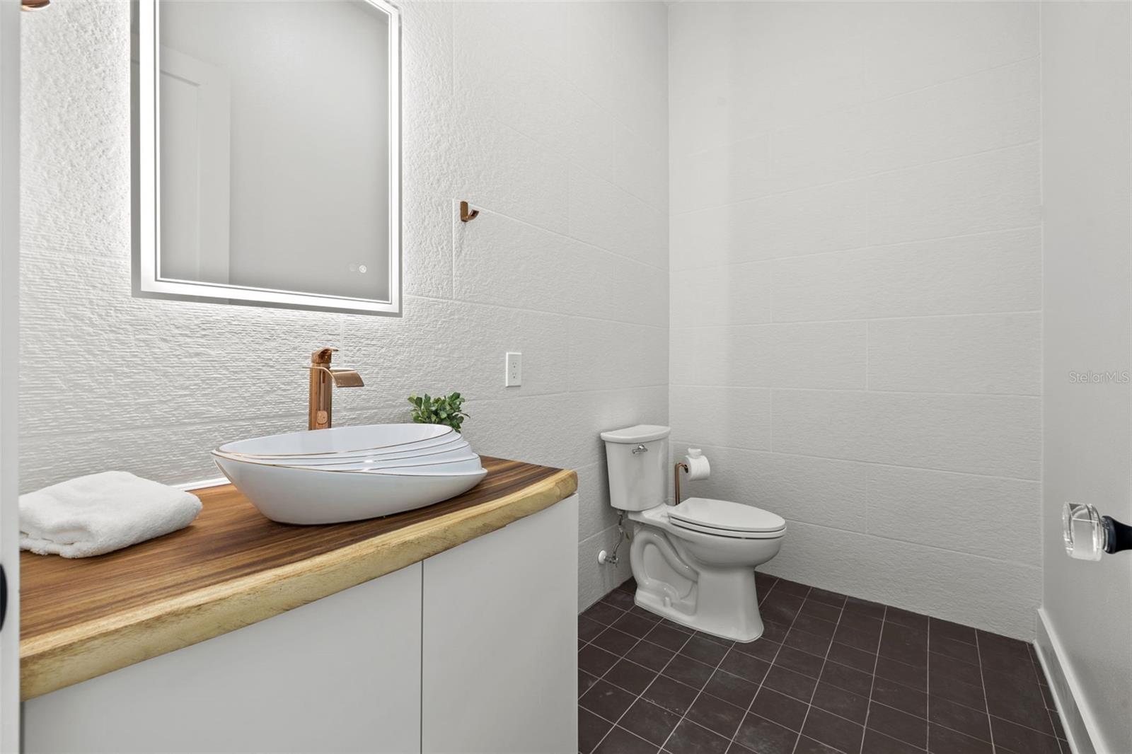 Half bathroom behind living area.