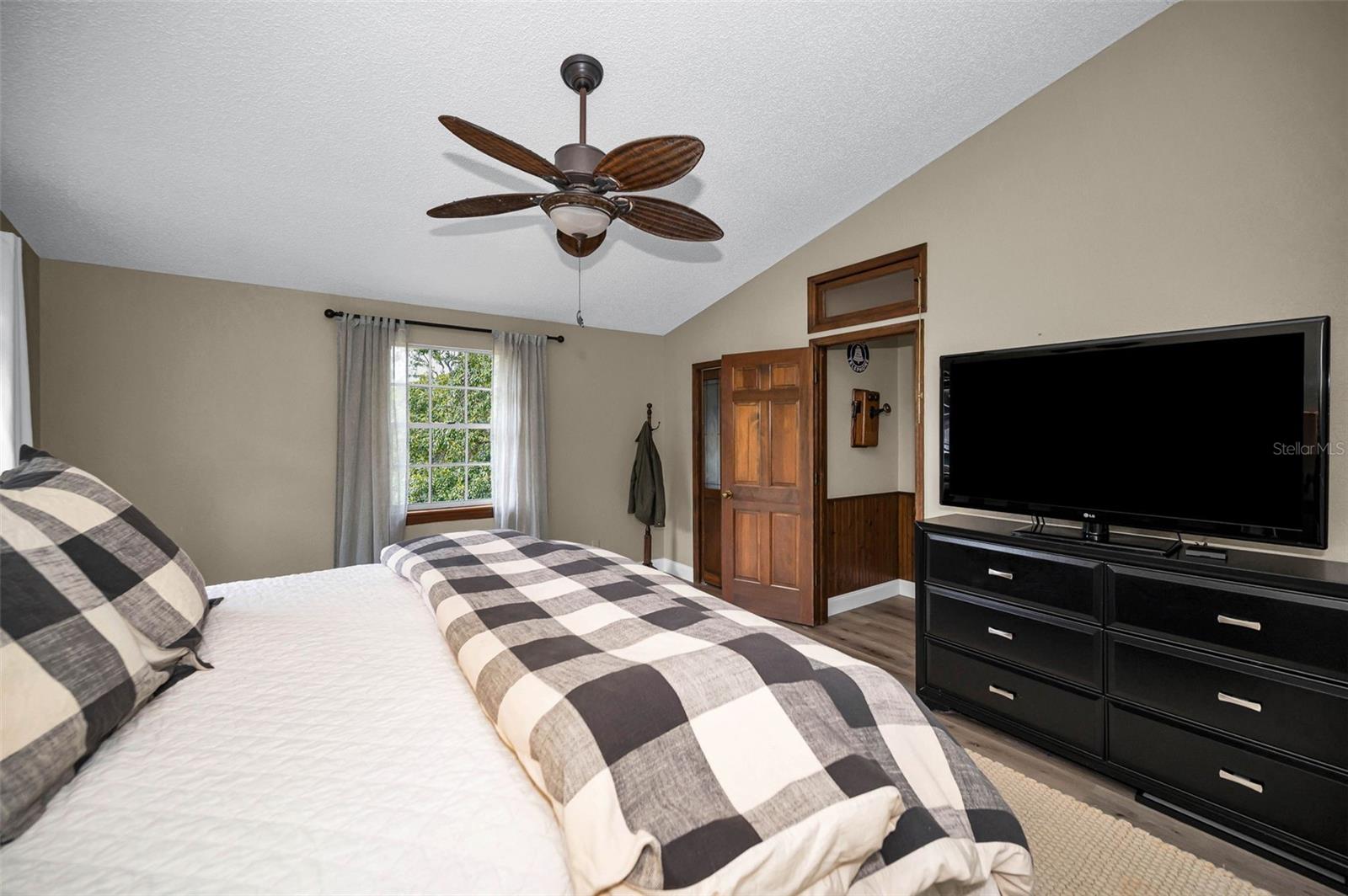 Bedroom with transoms that open and close over doorway
