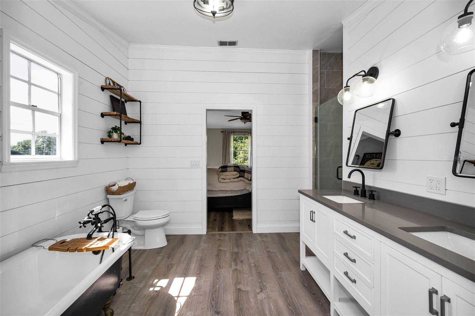 Primary Bathroom with claw foot tub and separate shower