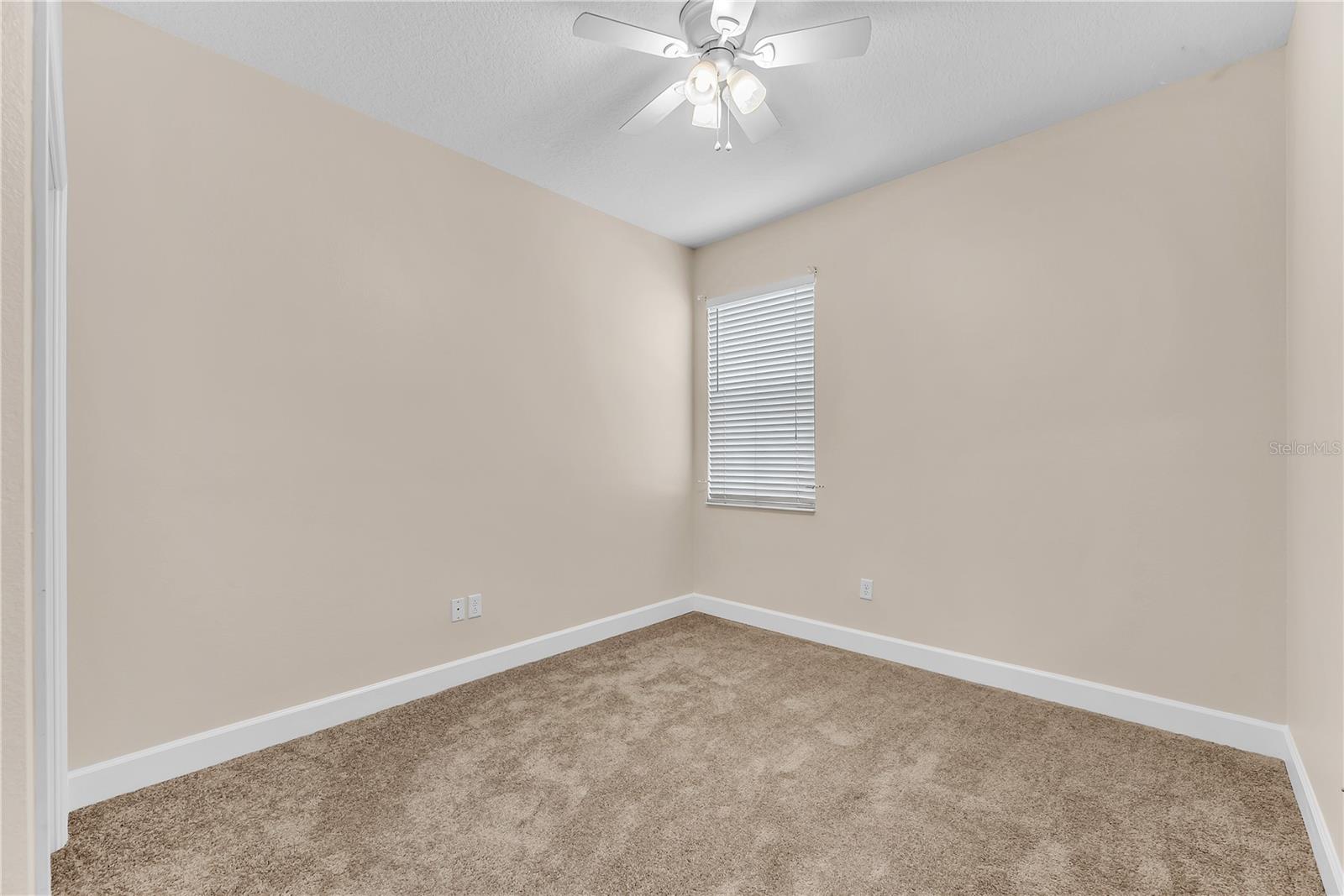 The popular three-way split bedroom layout offers 2 secondary bedrooms in the middle of the home with a shared full bathroom.