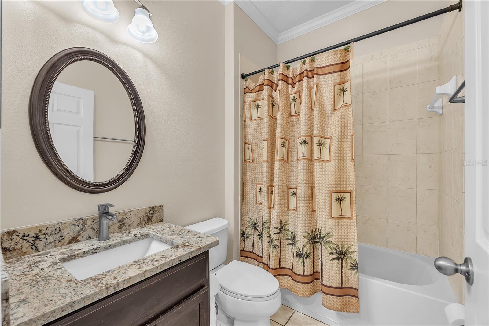 Bathroom #2 is located just off the stunning rotunda in the center of the home and has a tub/shower combo.