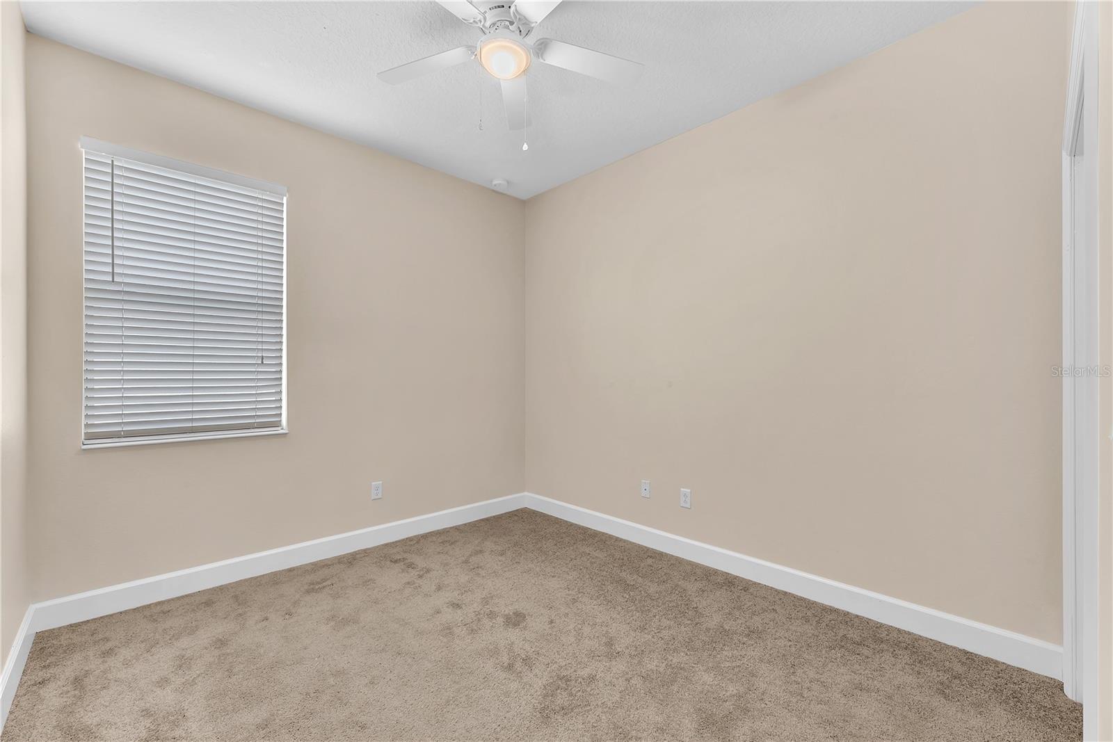 Secondary Bedroom #3. All bedrooms have newly installed carpet and are freshly painted.