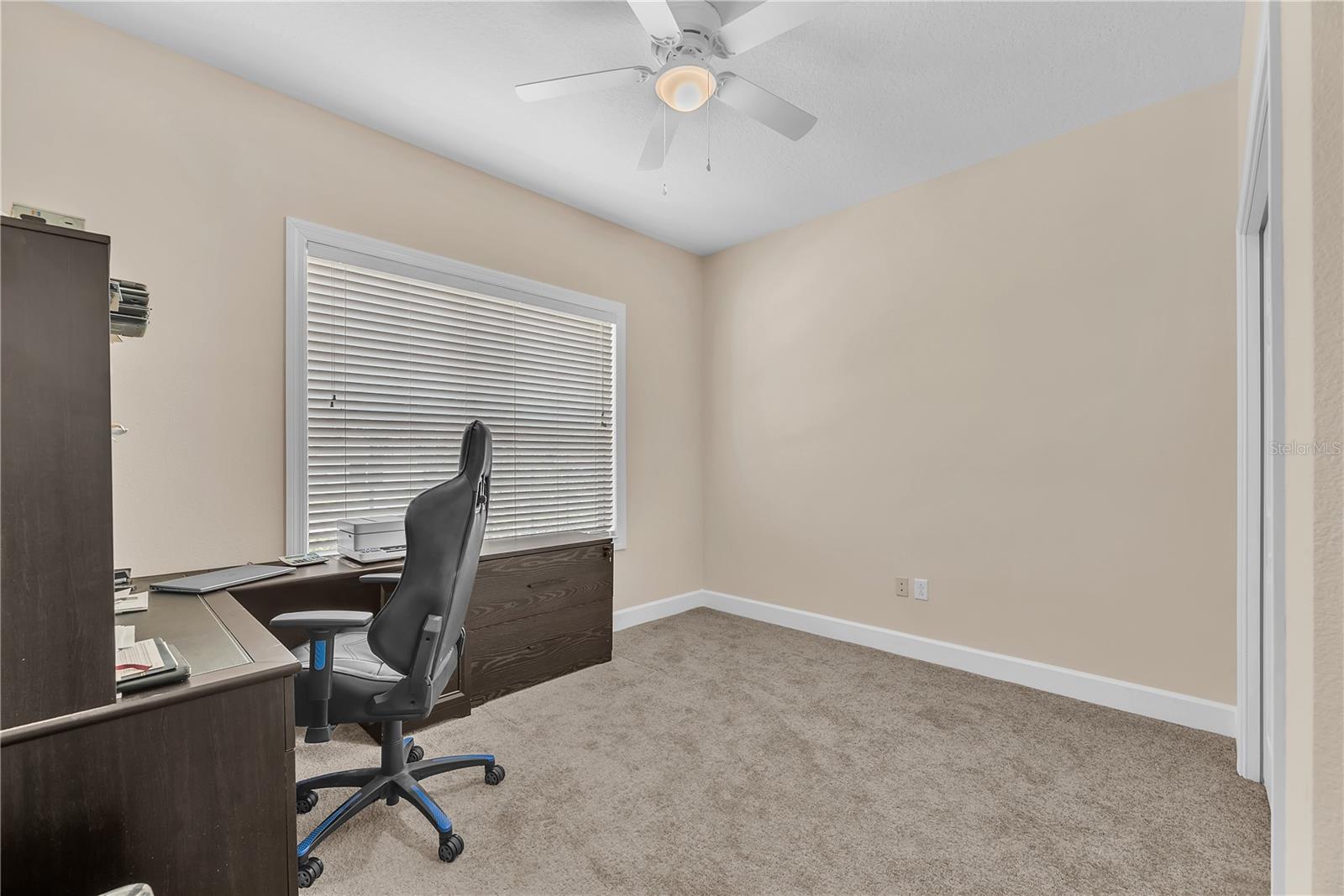 Thoughtfully positioned near a full bathroom, Secondary Bedroom #4 provides versatility as a guest suite, multigenerational living space, or productive work-from-home office.