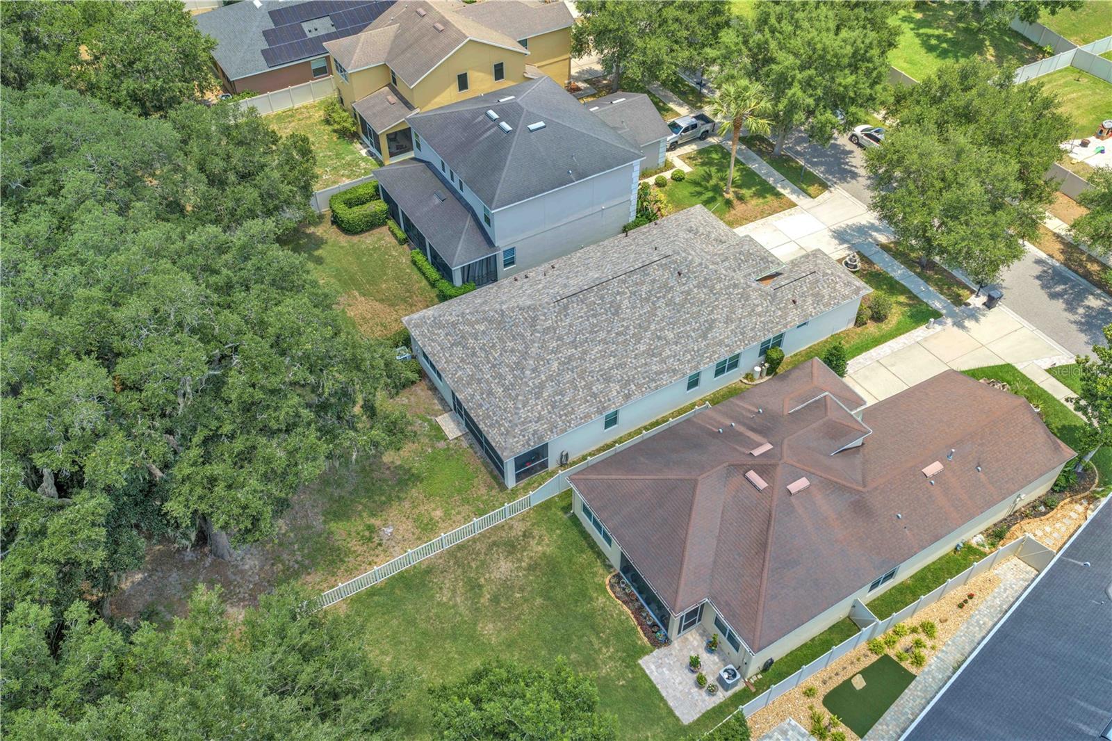 Backing to a serene green space, the backyard offers a tranquil setting and extra privacy.