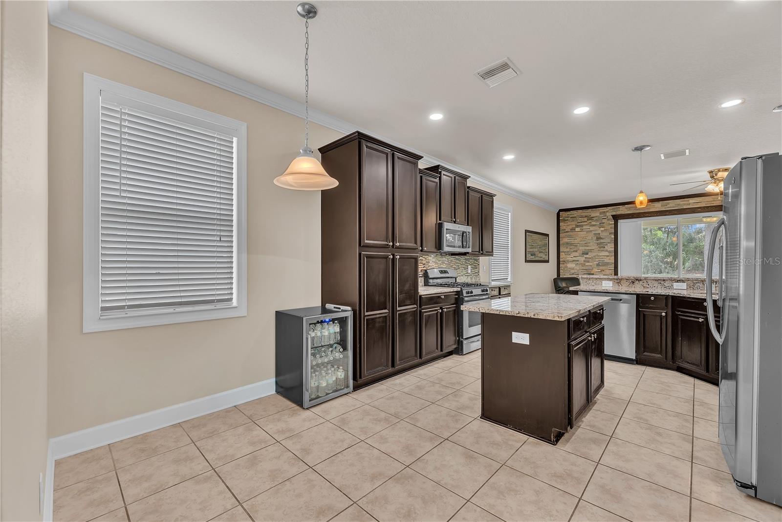 Enjoy a dedicated dinette area within the kitchen, offering a comfortable space for family meals.