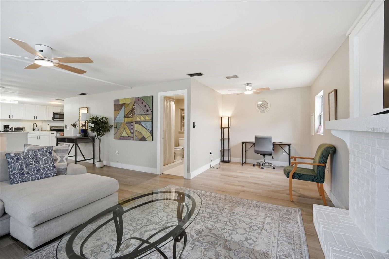 Flex space attached to living room, currently being used as a study and second bathroom