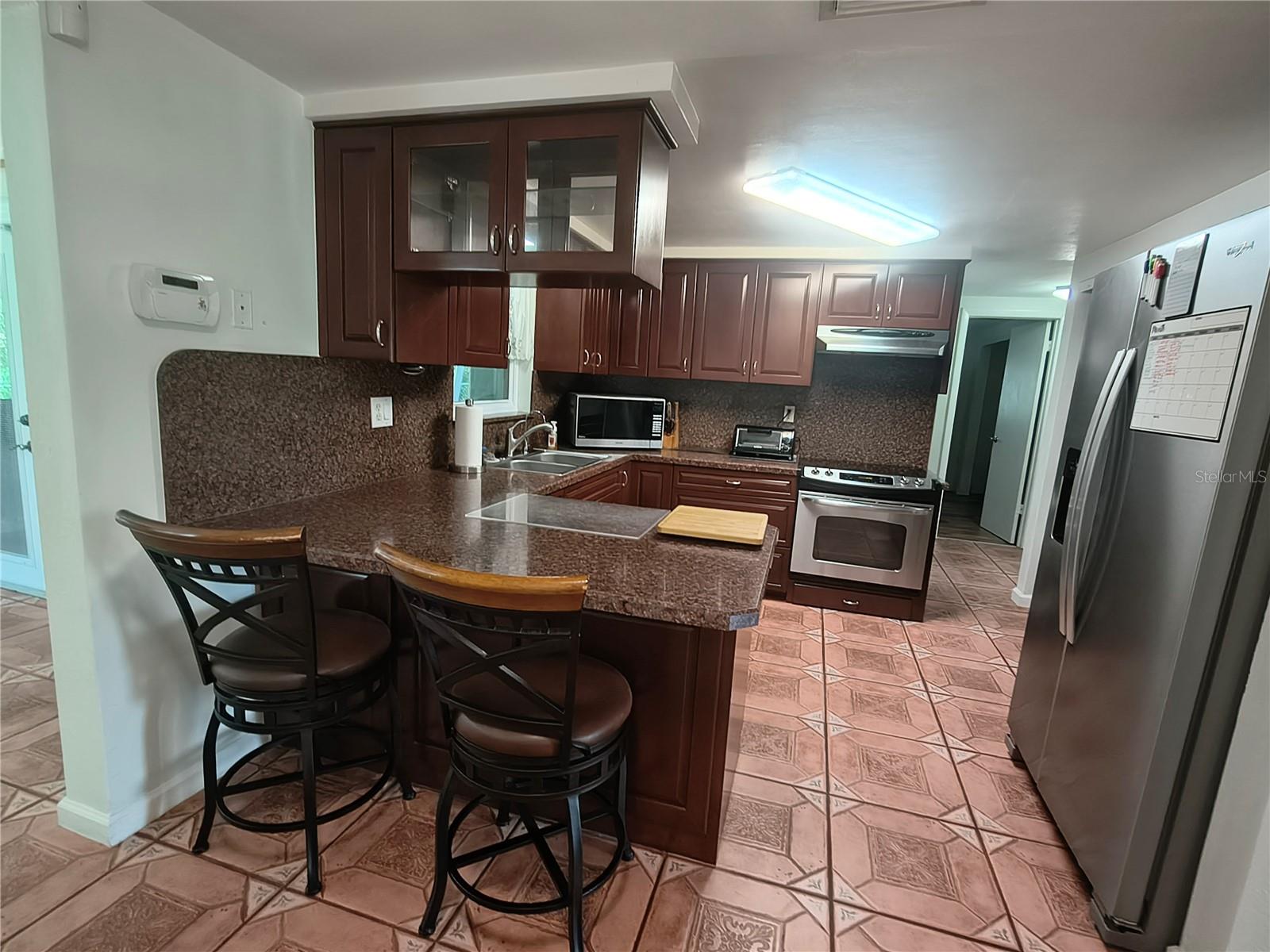 Real Wood Cabinets and  Newer Stainless Steel Appliances