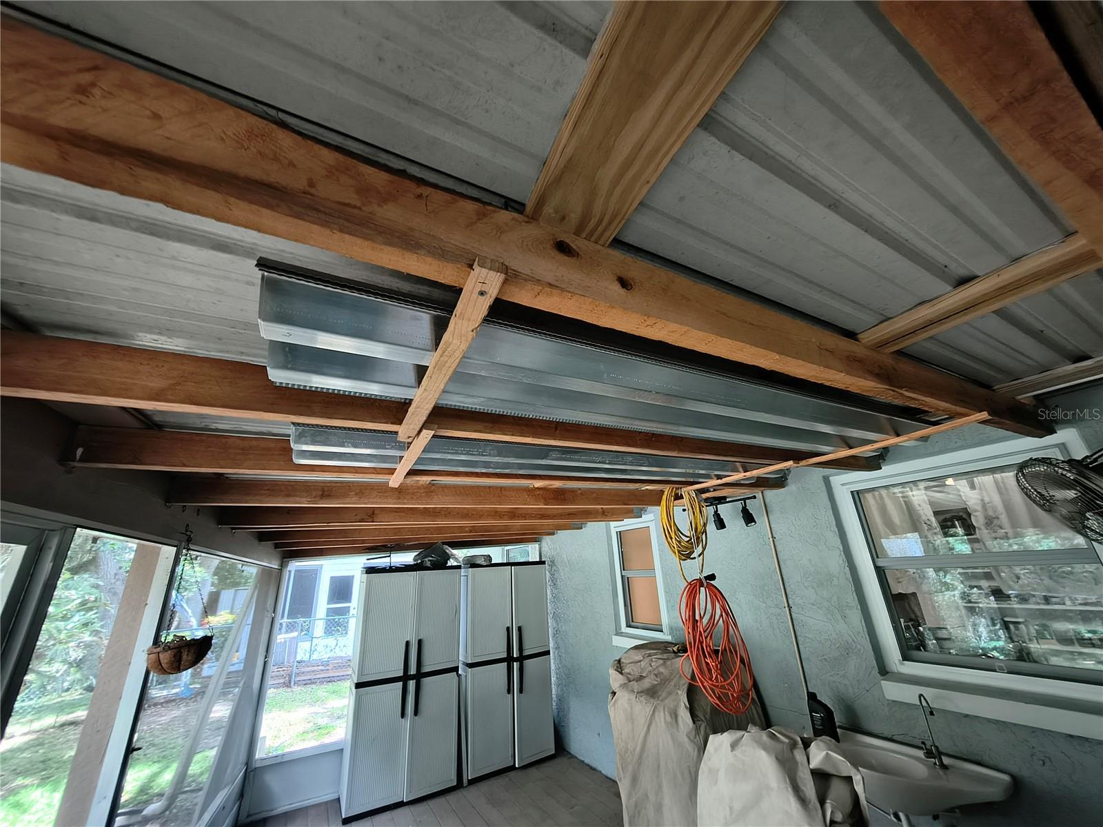 Windows have metal Hurricane Shutters stored on Lanai Ceiling
