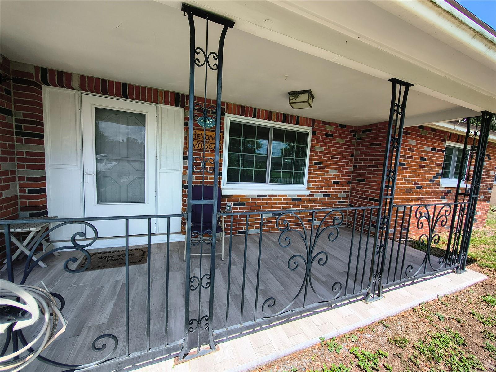 Wood Tile Front Patio  and wrought Iron in 2016