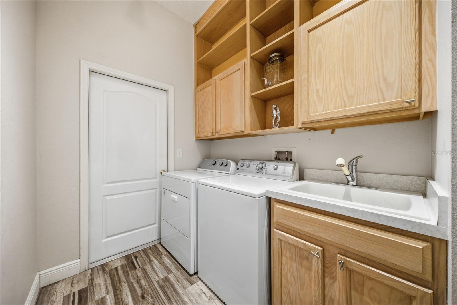 big laundry room with tons of closet space